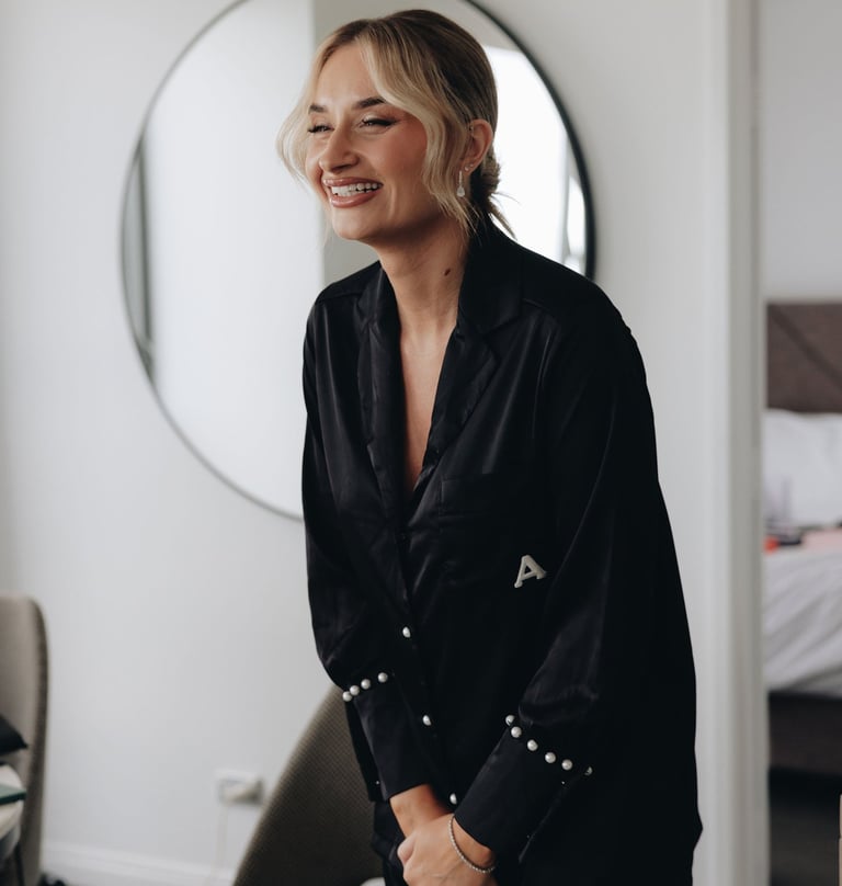 a woman in a black shirt laughing