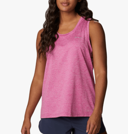 a woman in a pink tank top and shorts