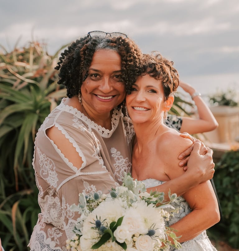 Jacquelyn, San Diego Destination Weddings hugs bride, wedding at Moonlight Beach Overlook, Encinitas
