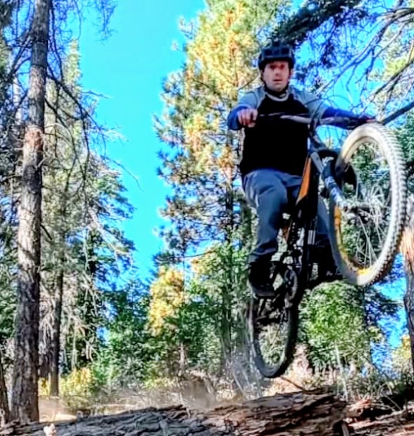 mountain biker going off a jump
