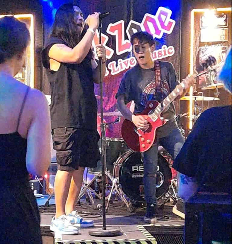 Singer and guitarist on stage at Rock Zone Bar near Soi 94, Hua Hin