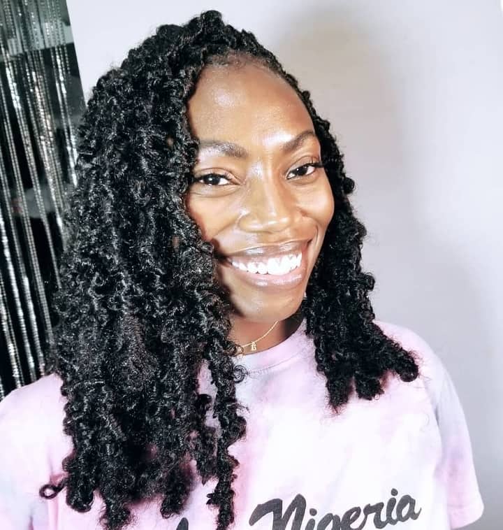 a woman with big black butterfly locs hairstyle