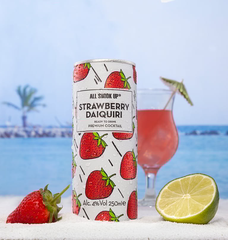 Strawberry canned drink on a beach
