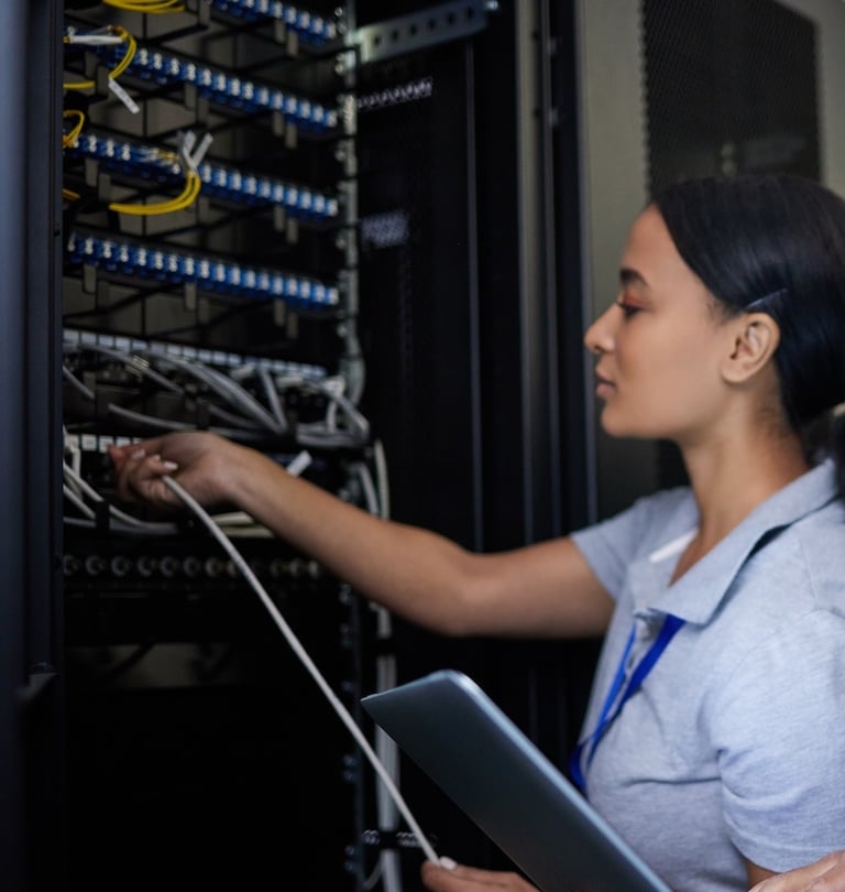 a man and woman in a server room