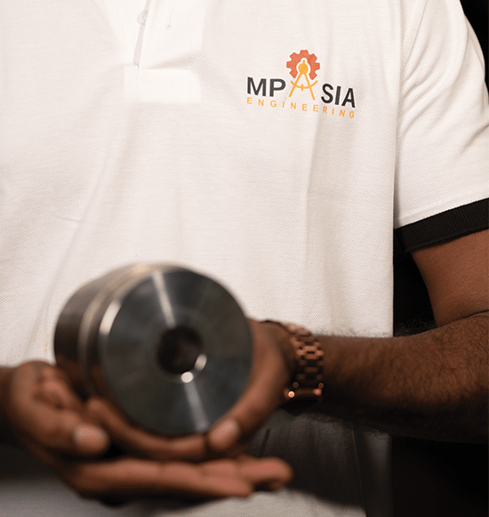 MP Asia Engineering Staff holding a CNC Precision Tool