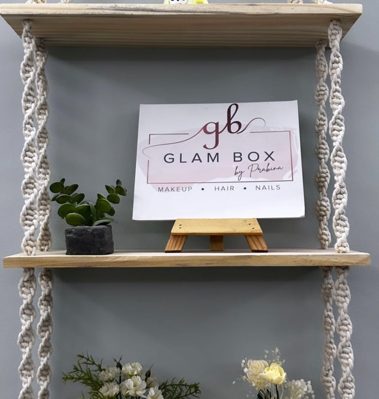 a shelf with a sign that says glambox
