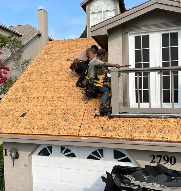 a man is working on a roof with a roof that is being built into a