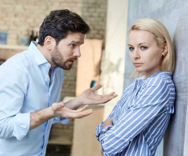 a man and woman standing next to each other