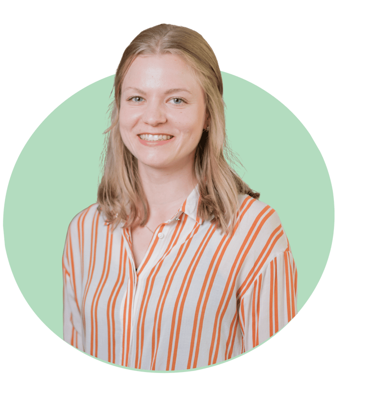 a woman with blonde hair and a striped shirt