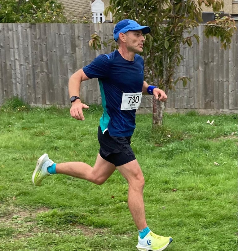 A male runner in a trail running race
