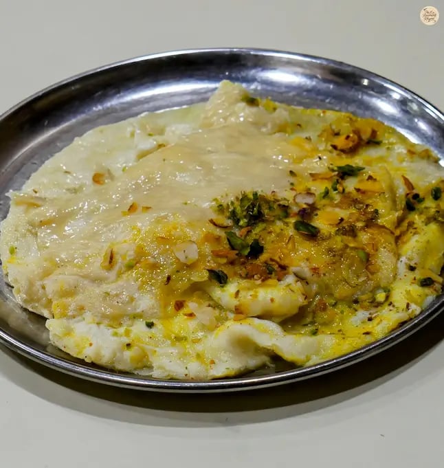 Traditional Malai Roti served at Vijay Restaurant in Jodhpur, a famous Rajasthani sweet delicacy.