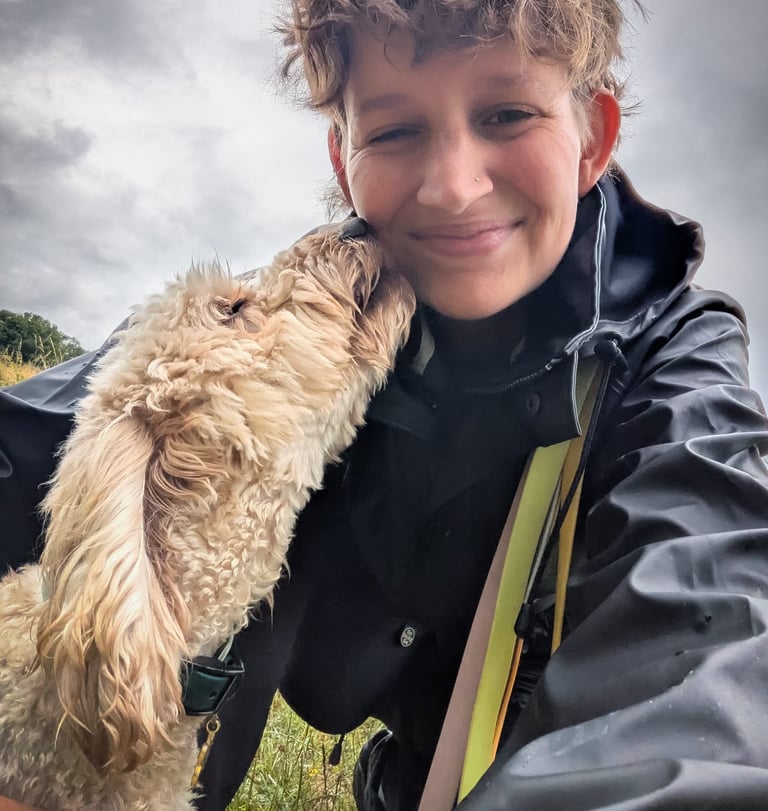 Image of a dog licking a woman's face