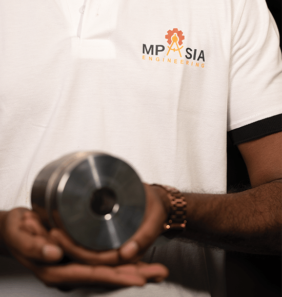 MP Asia Engineering Staff holding a CNC Precision Tool