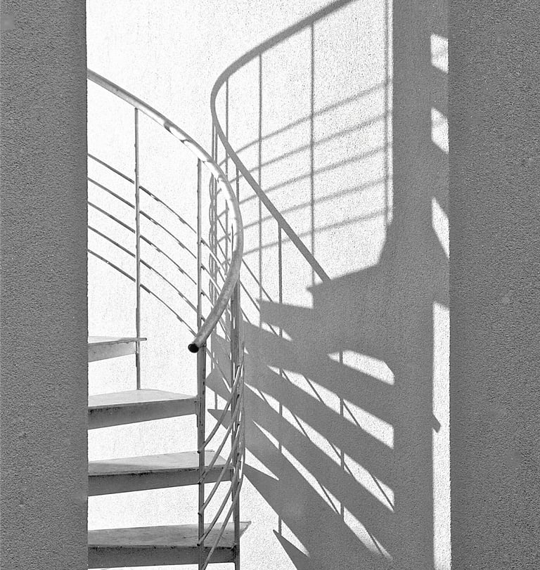 a spiral staircase with guardrails