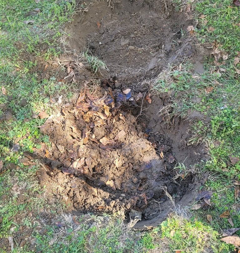 digging out the hole to place the pans