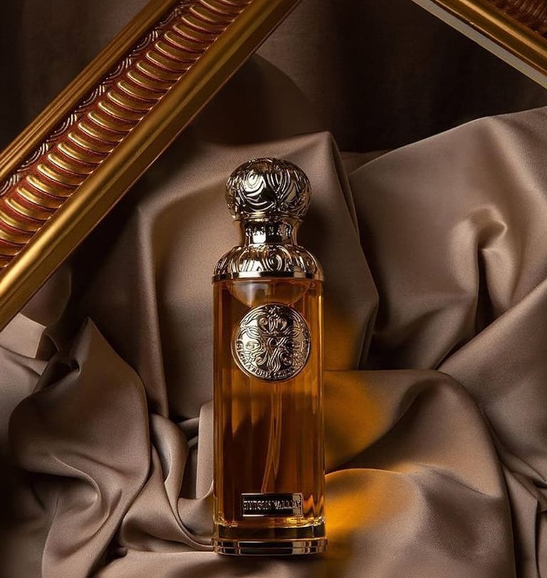 Gissah perfume bottle of perfume sitting on a cloth covered table