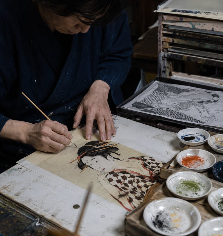 A Japanese artist carefully hand-painting a traditional Ukiyo-e woodblock print of a geisha.