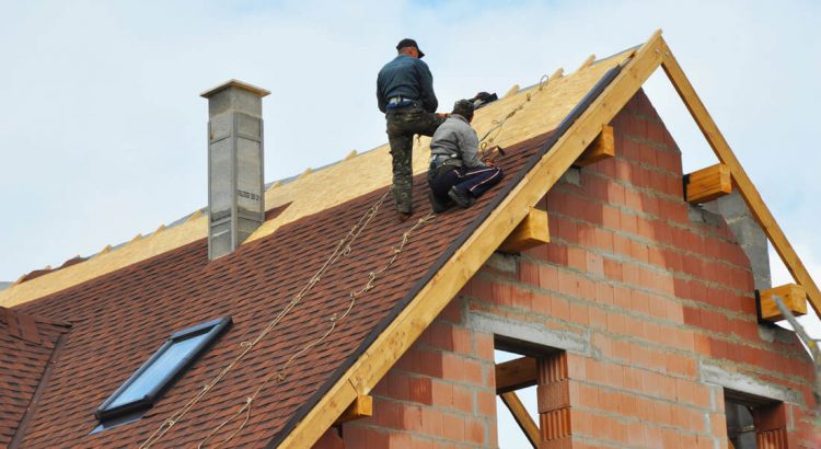 Tiling almost completed on one side of the new roof.
