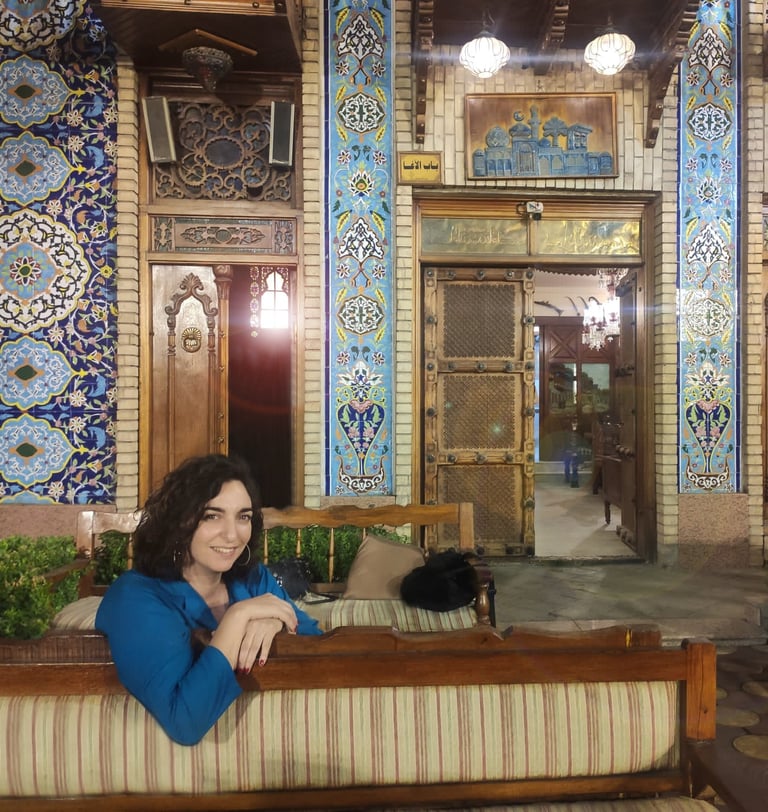 a woman sitting on a couch in a room