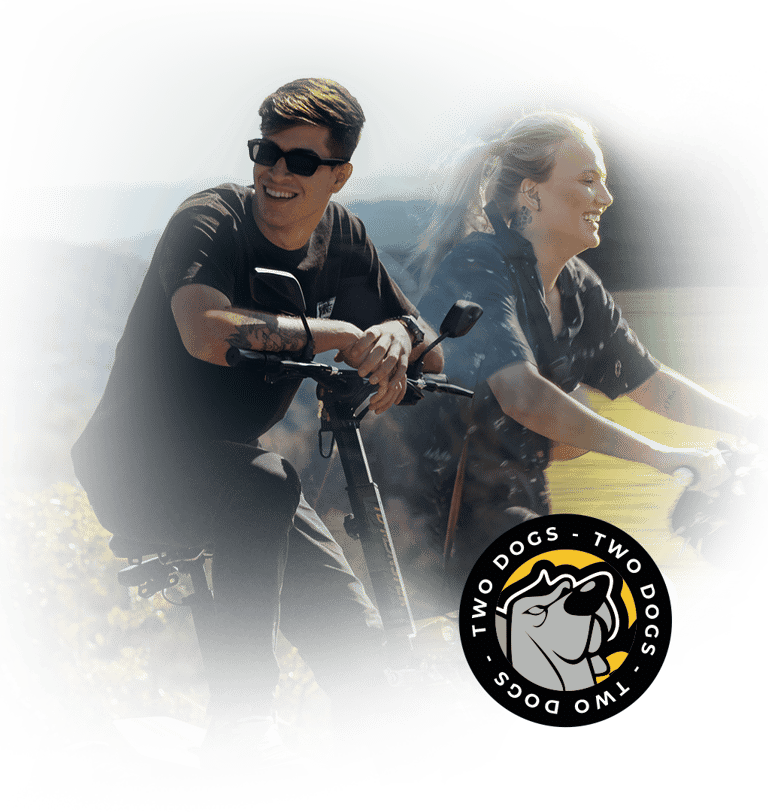 a man and woman riding on a scooter