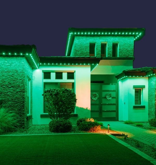 House decorated with permanent holiday lighting for seasonal celebrations