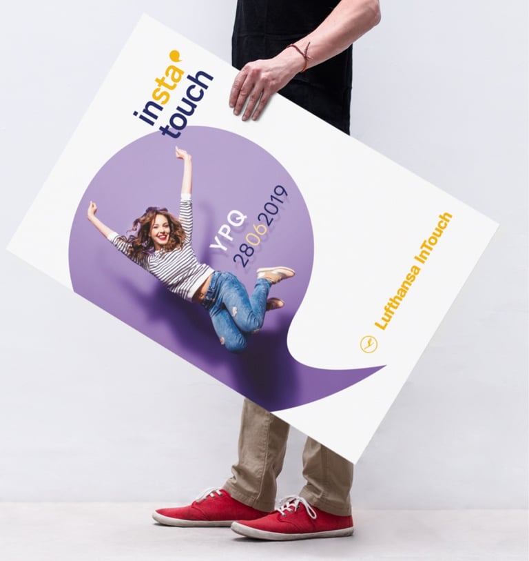 a person holding a sign that says, instatouch