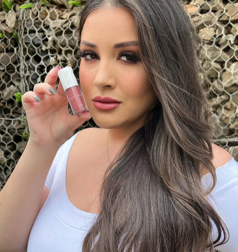 a woman with long hair and a white shirt