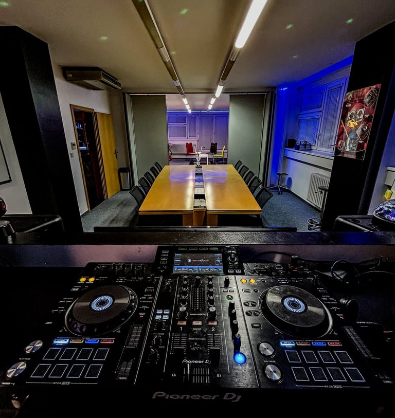 Group DJ course classroom with mixing setup at Prague DJ Society