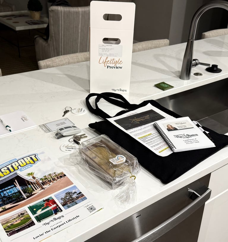 Lifestyle Preview welcome materials, keys, and maps displayed on the kitchen island at The Villages