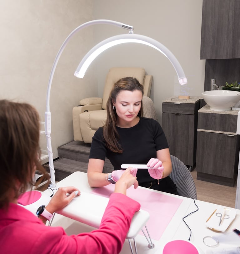 Anastasia wit ha client in her nail studio in Sausalito