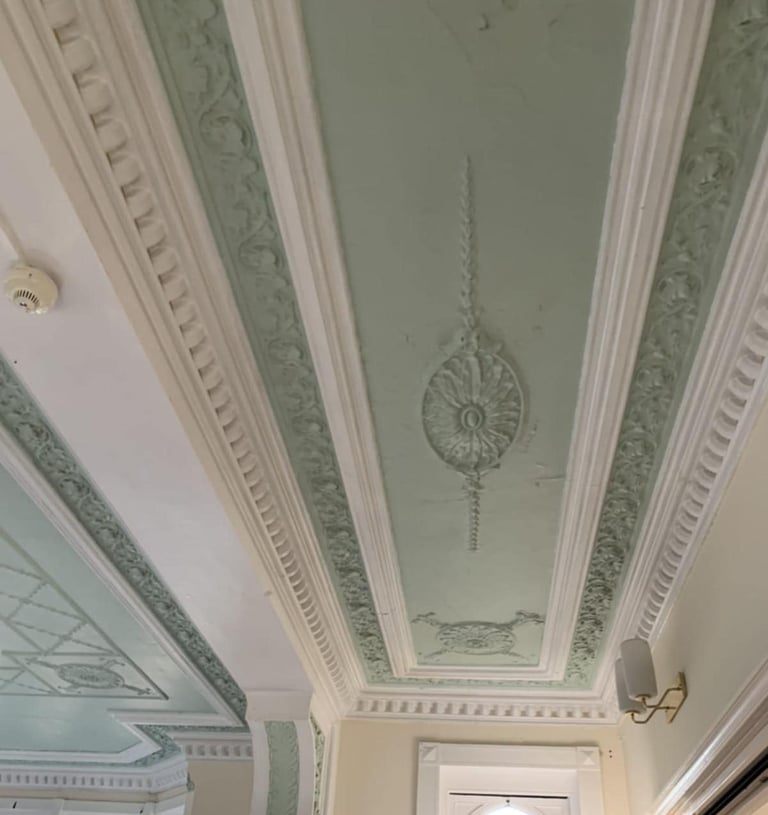 a ceiling painted white and green by pbp services at a home in pershore