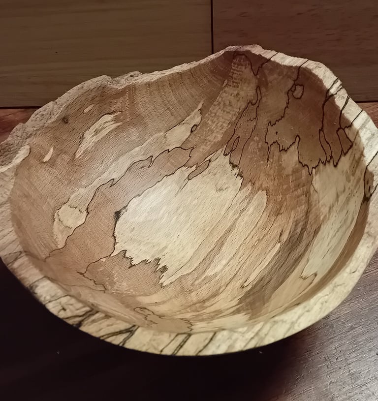 Turned spalted beech bowl with rough cleaved edge