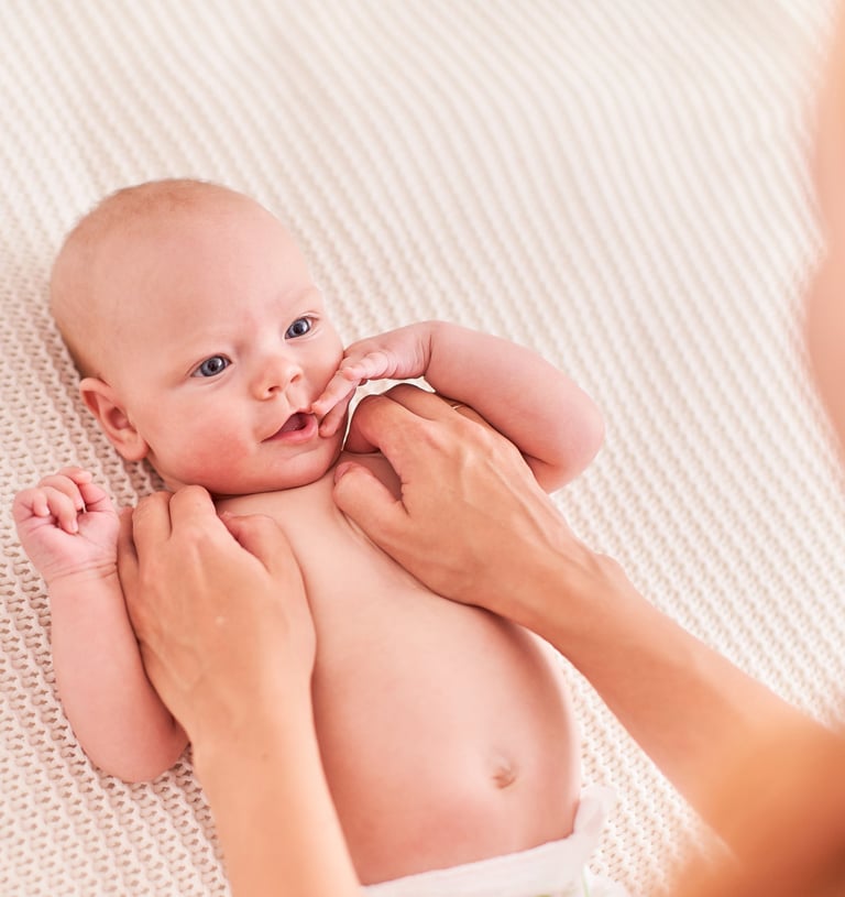 a baby is being held by a woman