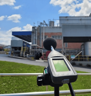 a microphone and a microphone in front of a building