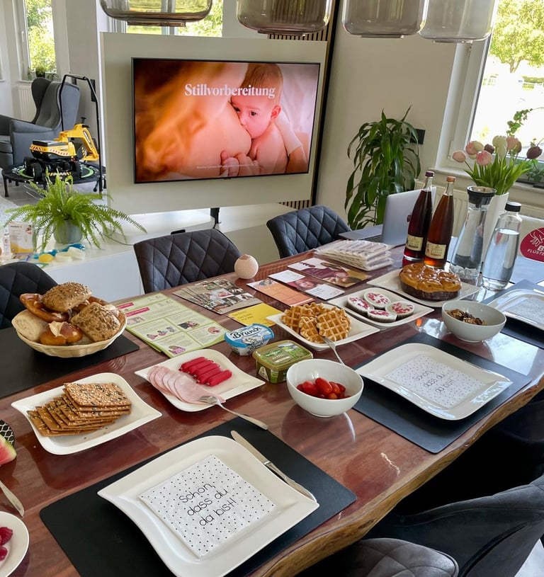 a table with plates of food and drinks