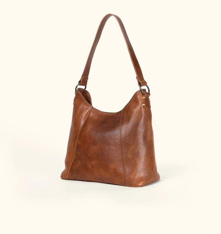 a brown leather handbag with a brown leather bag