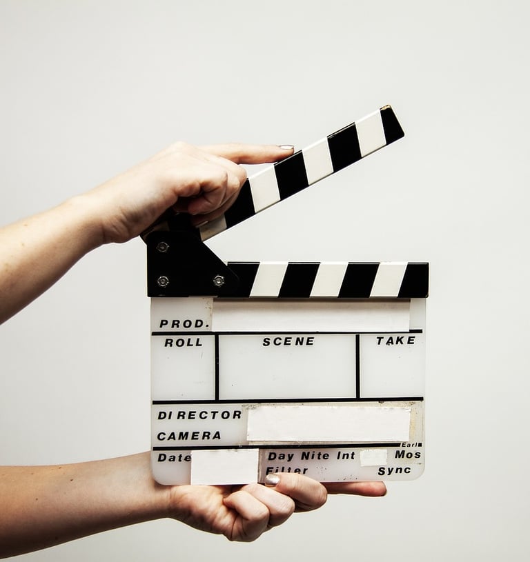 a person holding a clapper board 