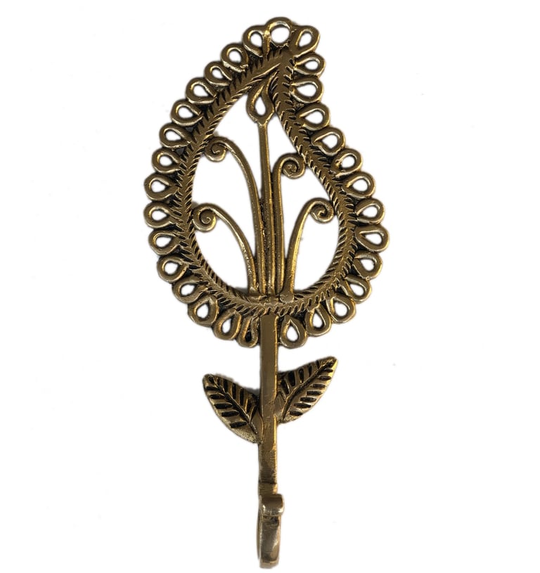 a decorative metal flower with a leaf on it