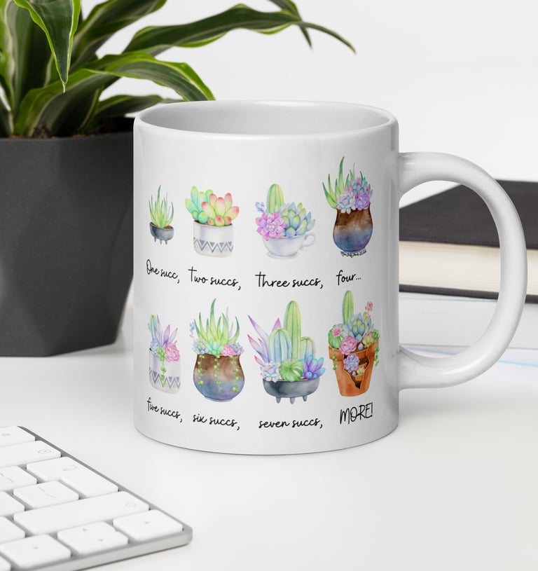 White mug with watercolor succulents on desk — plant-themed home décor from Miss Chatty Plants