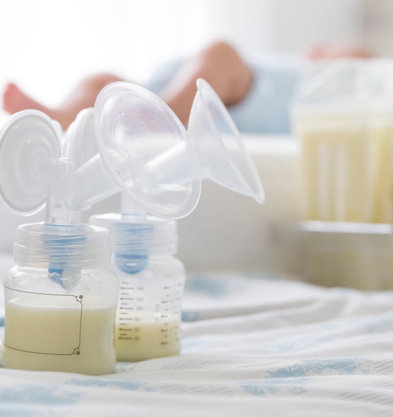 a baby bottle with a bottle of milk and a bottle of milk
