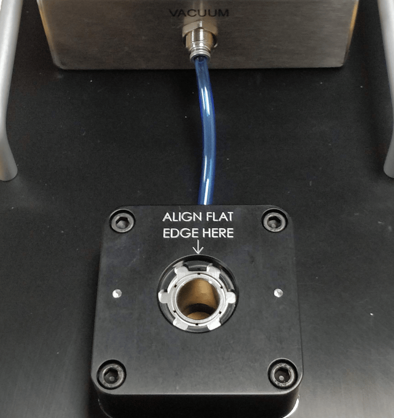Vacuum metrology fixture for holding a soft rubber medical dome