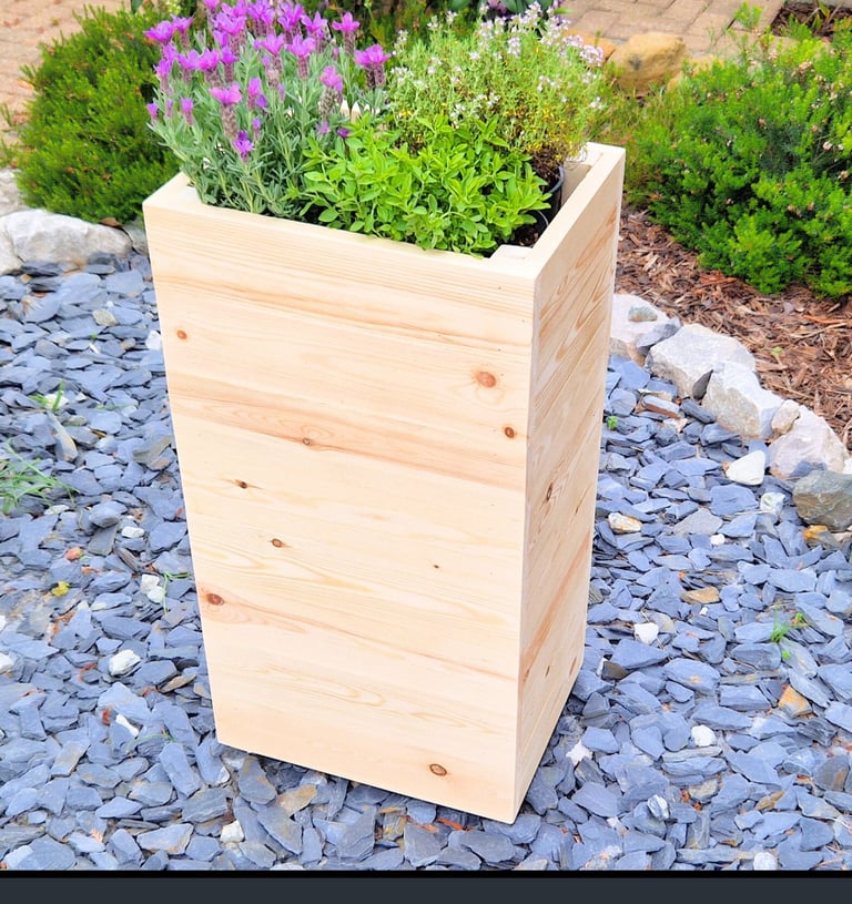 tall planter box made from natural wood plant pot cafe restaurant style border screening raised plant pot natural wood