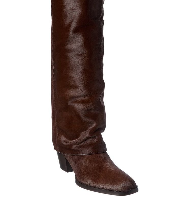 a pair of Fendi boots with a brown leather boot