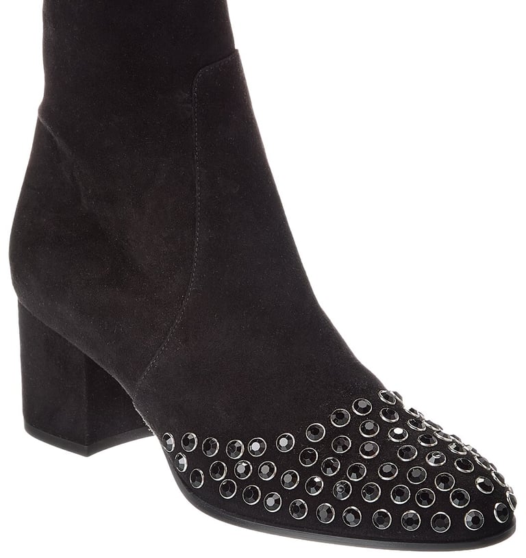 a woman's Alaia black suede ankle - high heeled boots
