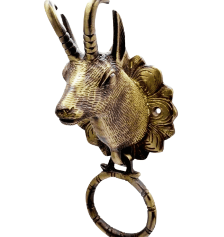a goat head with a ring on it's ring
