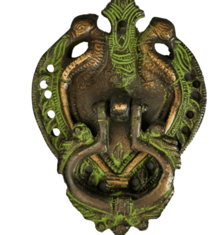 a metal wall mounted with a green dragonfly