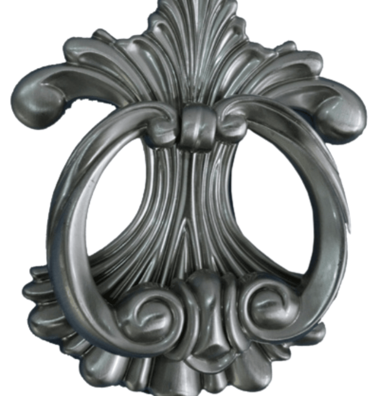 a metal door handle with a decorative design
