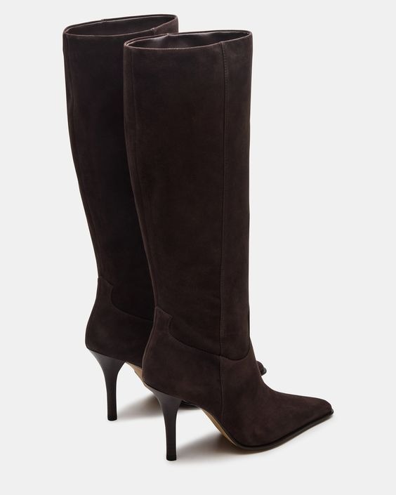 a pair of Alaia boots with a high heel and a high heel