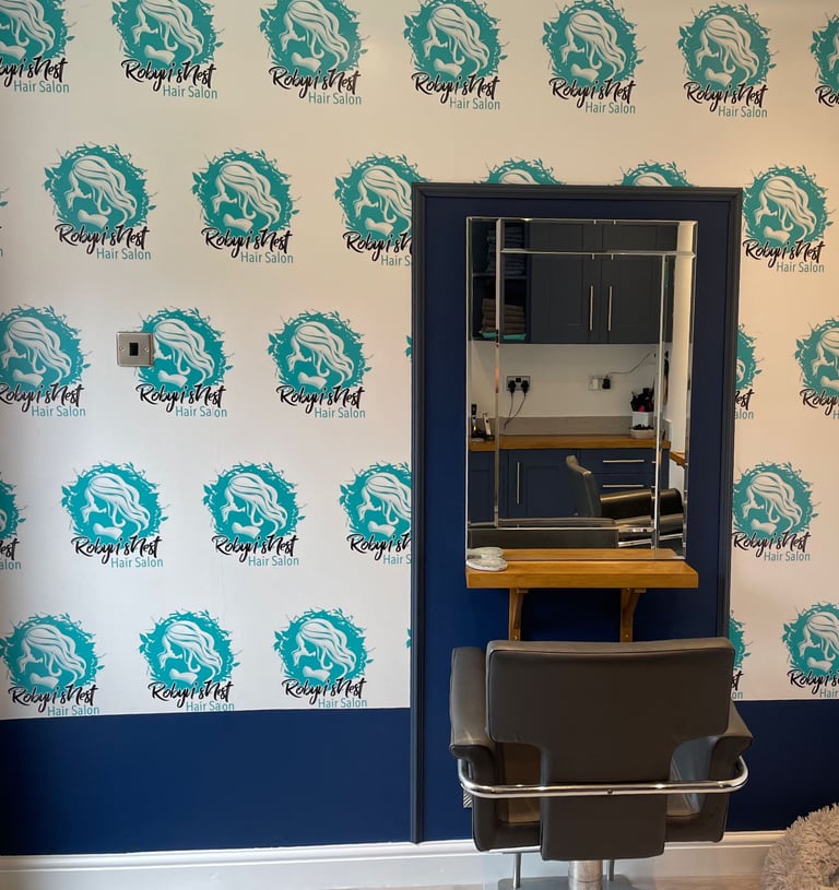 a chair with a mirror and a mirror in the background