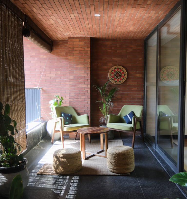 a living room with a couch and a chair- clayworks CBD